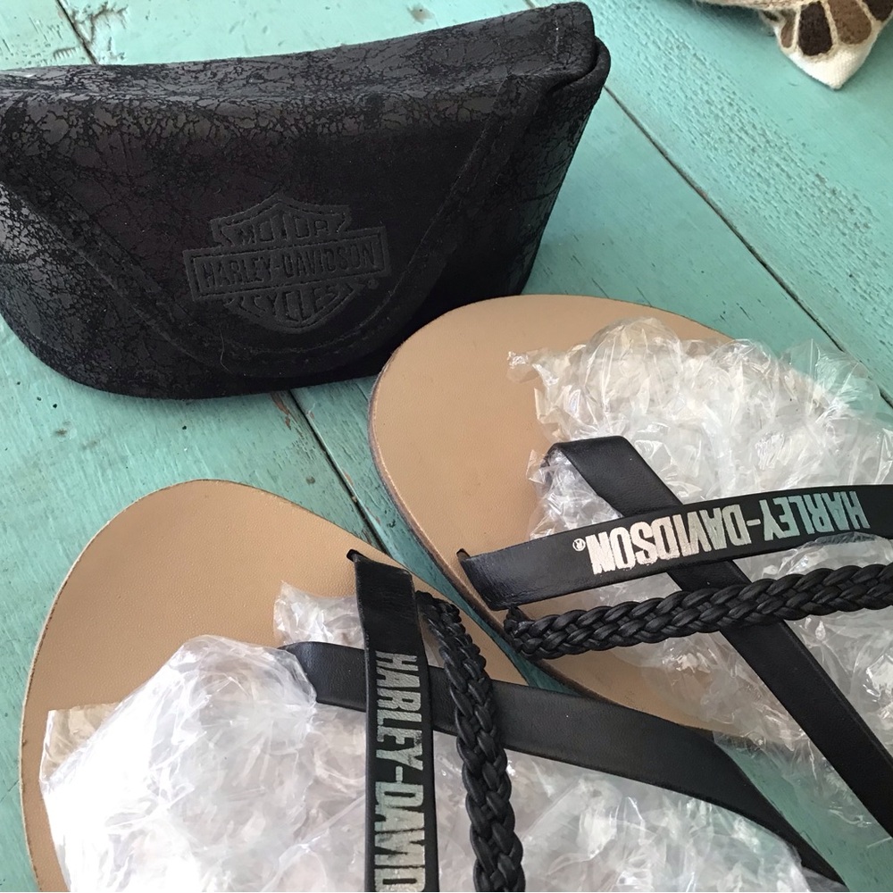 Harley Davidson sandals and eyewear case.